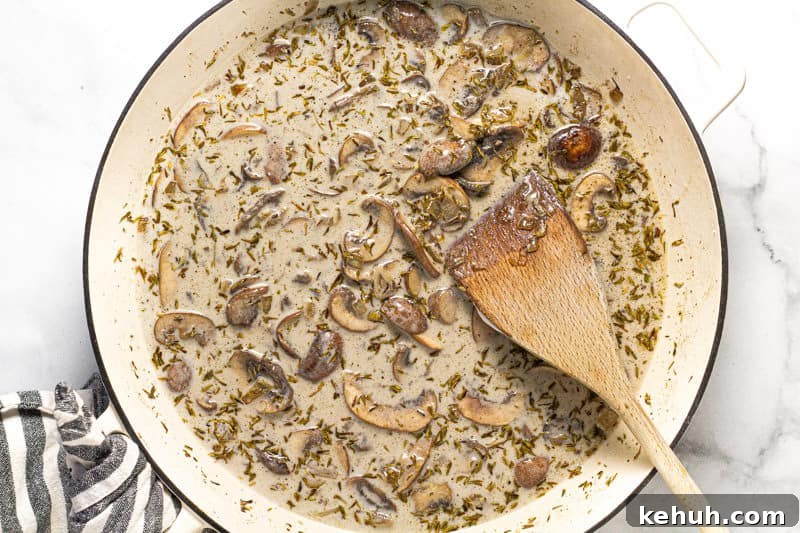 Vegan Mushroom Stroganoff Without Cashew Cream or Roux 8 Large white pan with creamy vegan mushroom stroganoff in it