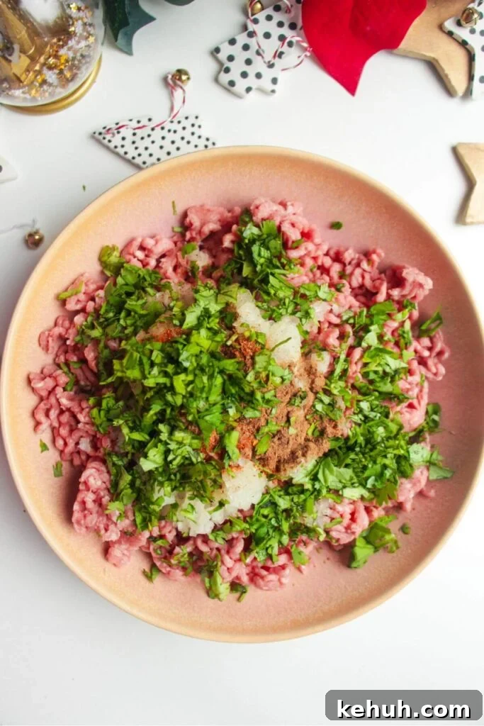 Festive Mini Meatballs Recipe for Holiday Appetizers 4 Meatball ingredients in a pink bowl.