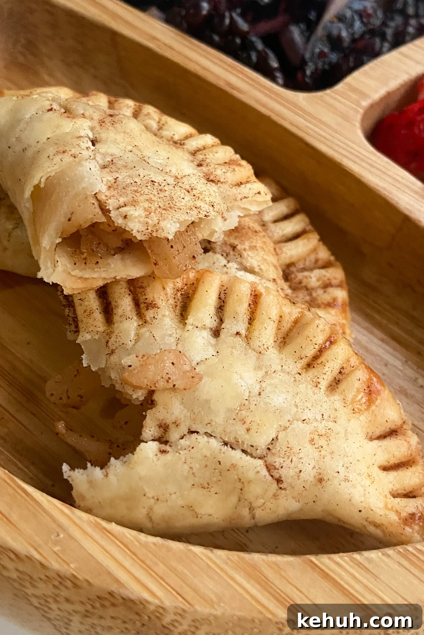 Crispy Apple Pie Empanadas: Homemade Recipe for Fall Desserts 6 Apple pie empanadas with cinnamon apple pieces
