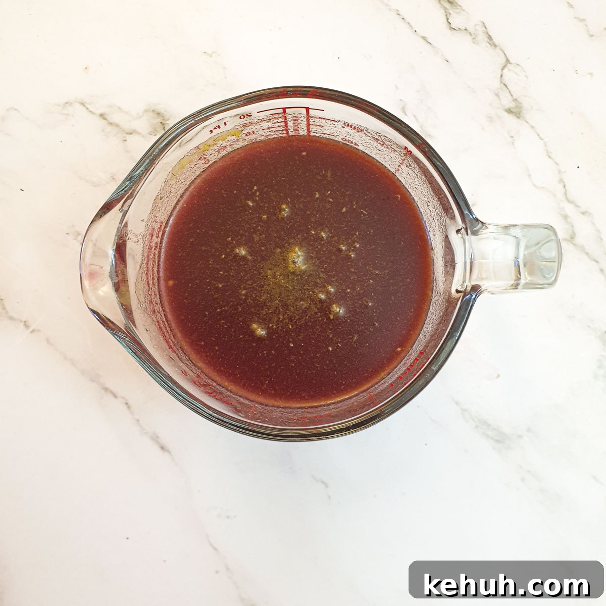 A jug of stock ready to be added to the slow-cooker.