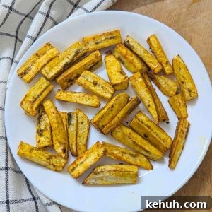 Plantain fries served on a white plate after air frying