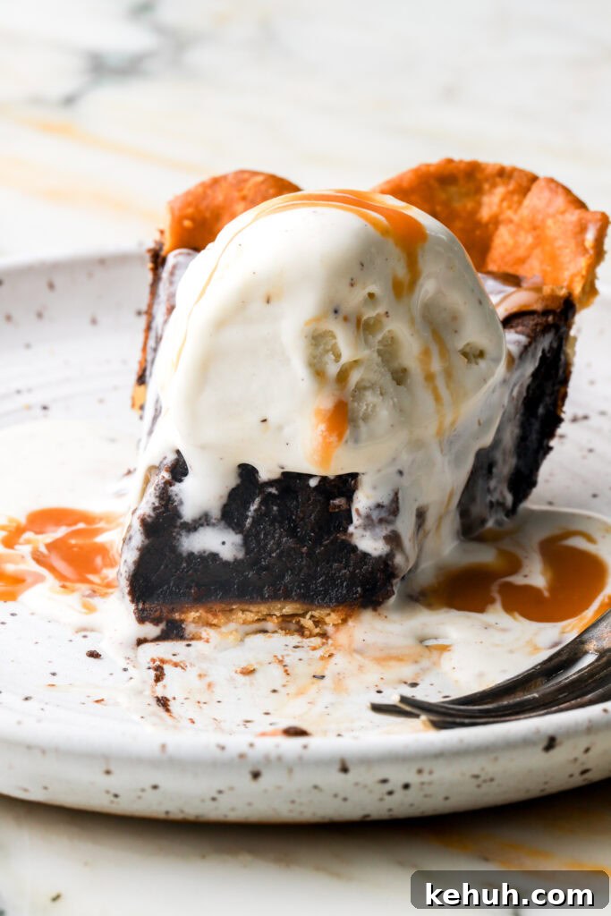 Decadent Chocolate Brownie Pie Recipe for Chocolate Lovers 18 close up of a slice of brownie pie with ice cream