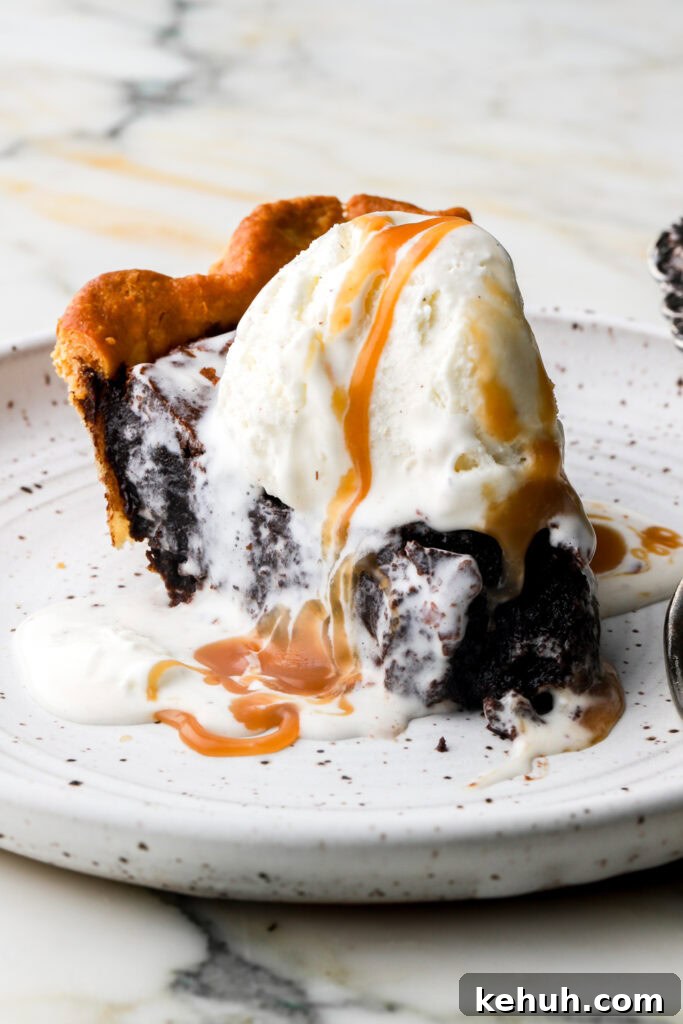 Decadent Chocolate Brownie Pie Recipe for Chocolate Lovers 19 slice of brownie pie topped with vanilla ice cream and caramel sauce