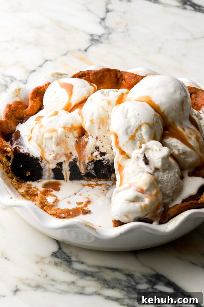 Decadent Chocolate Brownie Pie Recipe for Chocolate Lovers 21 brownie pie in pie dish topped with vanilla ice cream