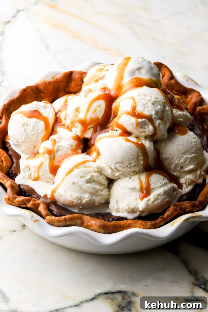 Decadent Chocolate Brownie Pie Recipe for Chocolate Lovers 22 a whole tub of vanilla ice cream scooped on the pie