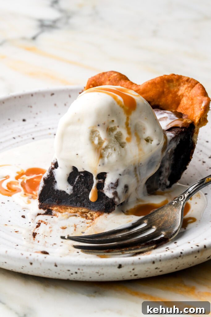 Decadent Chocolate Brownie Pie Recipe for Chocolate Lovers 23 slice of brownie pie topped with vanilla ice cream and caramel sauce