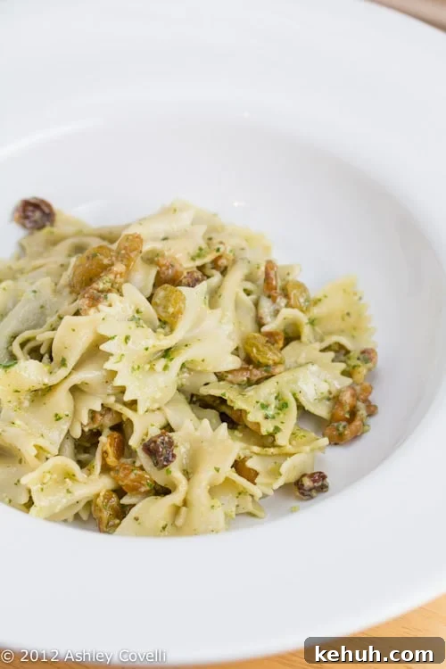 Mold-Ripened Cheese Day: Arugula & Walnut Pesto Farfalle 2 Bowl of farfalle with arugula-walnut pesto.