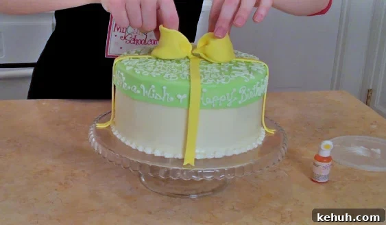 CUTE Hat Box Cake with a Frosted Lid! Free step by step cake decorating tutorial by MyCakeSchool.com.