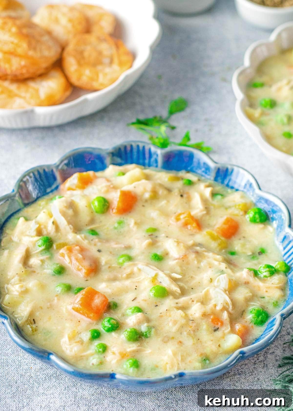 Instant Pot Chicken Pot Pie Soup in a blue bowl.