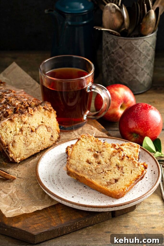 Cinnamon Apple Quick Bread Recipe for Moist, Spiced Loaves 11 slices of warm cinnamon apple bread served on a white plate