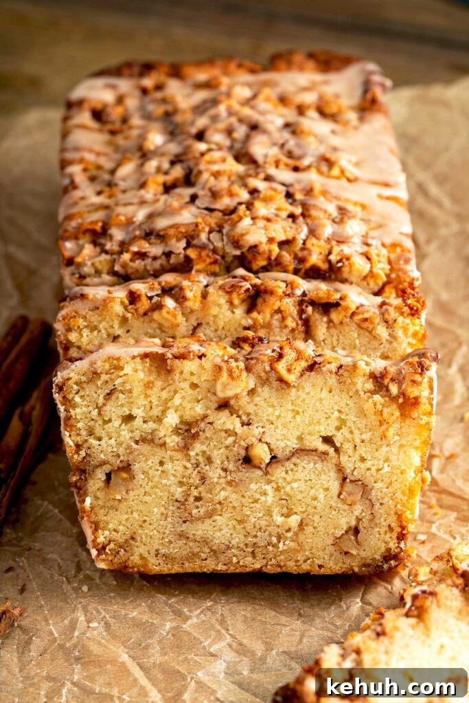 Cinnamon Apple Quick Bread Recipe for Moist, Spiced Loaves 3 Quick bread with a brown sugar and apple streusel running through the middle of the bread.