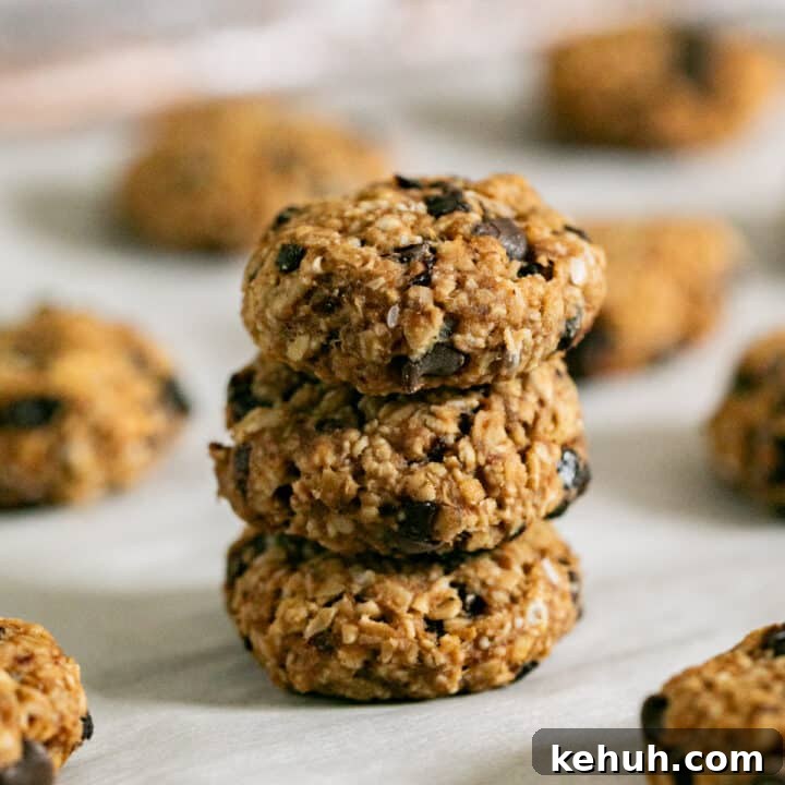 3 breakfast cookies stacked on each other with the other cookies around it.