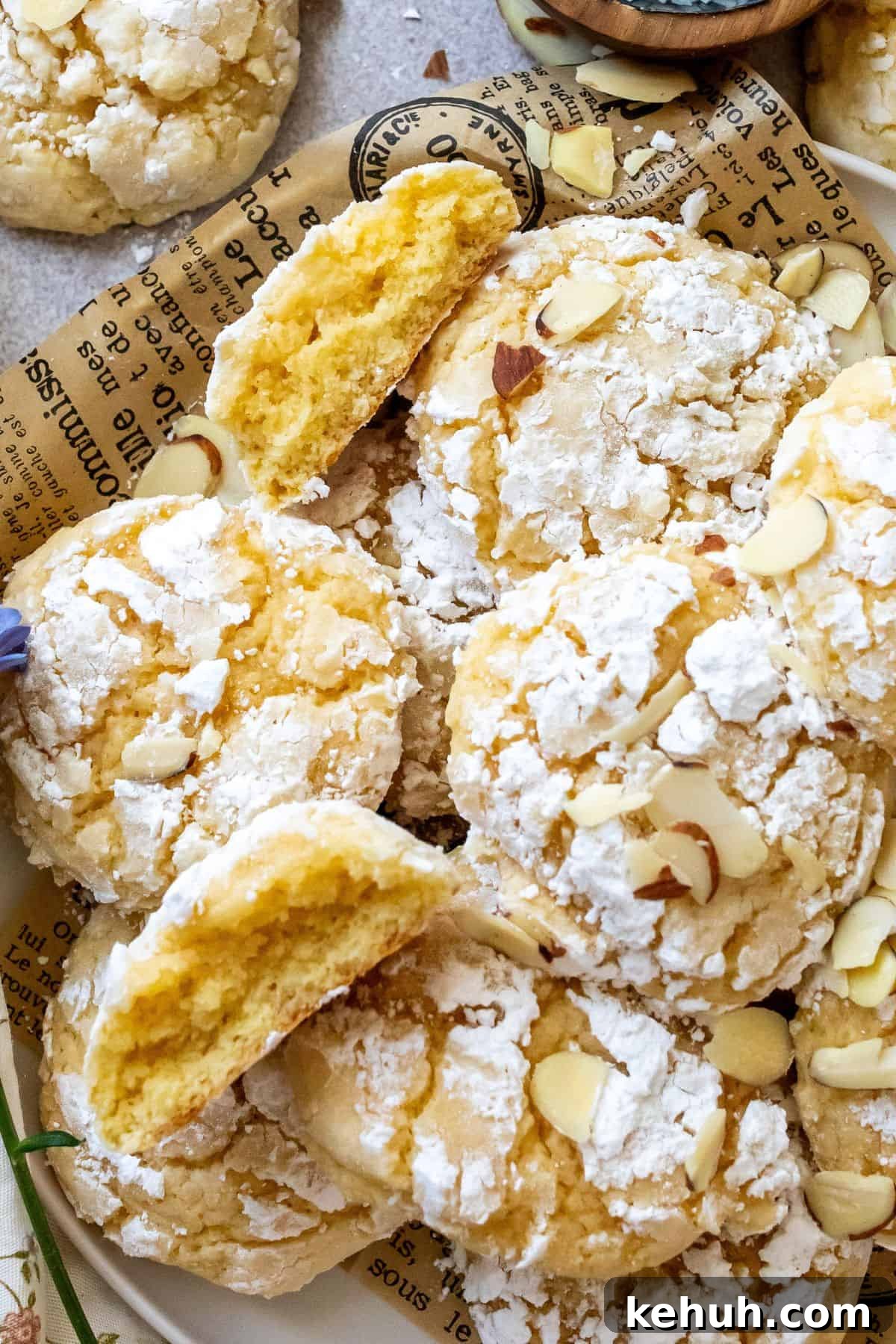 Lemon Crinkle Cookies up close with almonds.