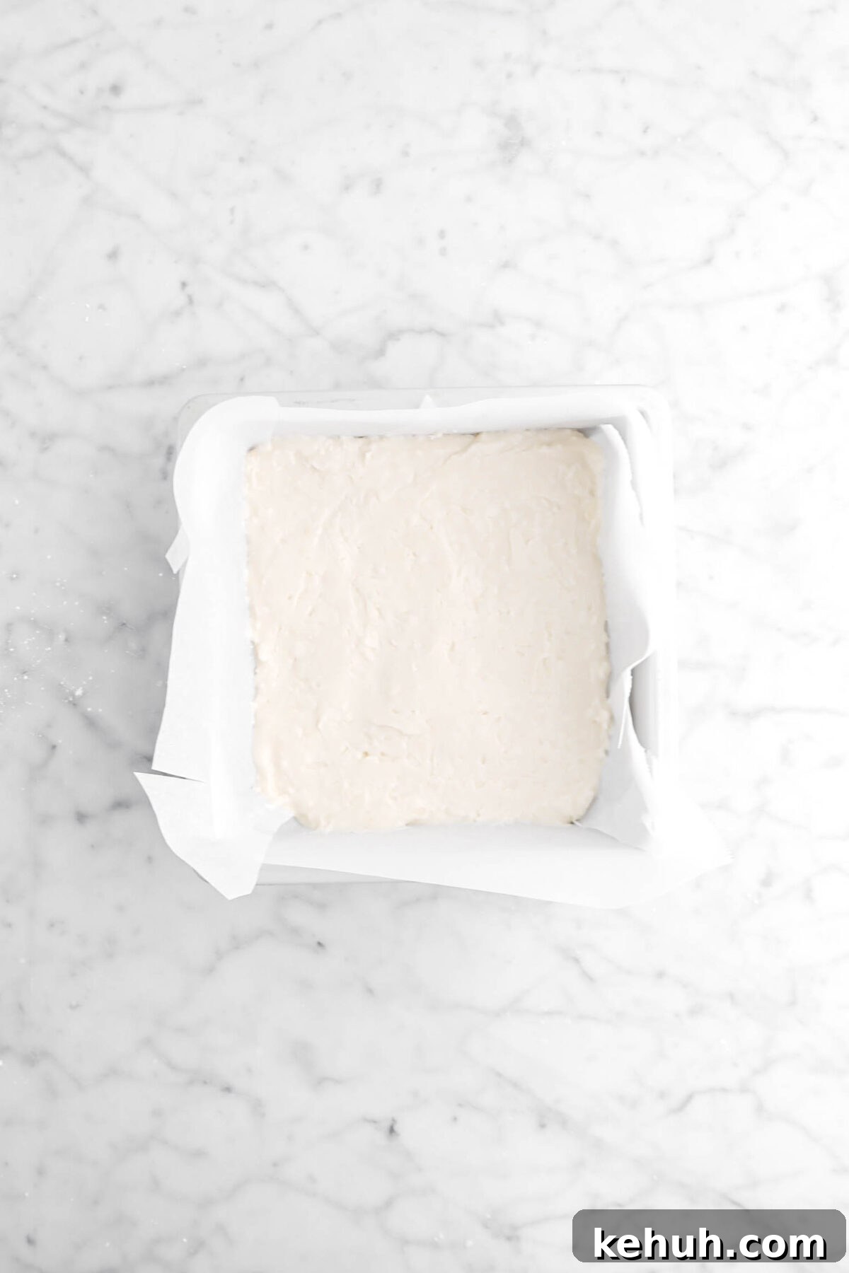 Coconut Cream-Filled Chocolate Truffles: Decadent Homemade Recipe 12 coconut fondant pressed down into parchment lined pan