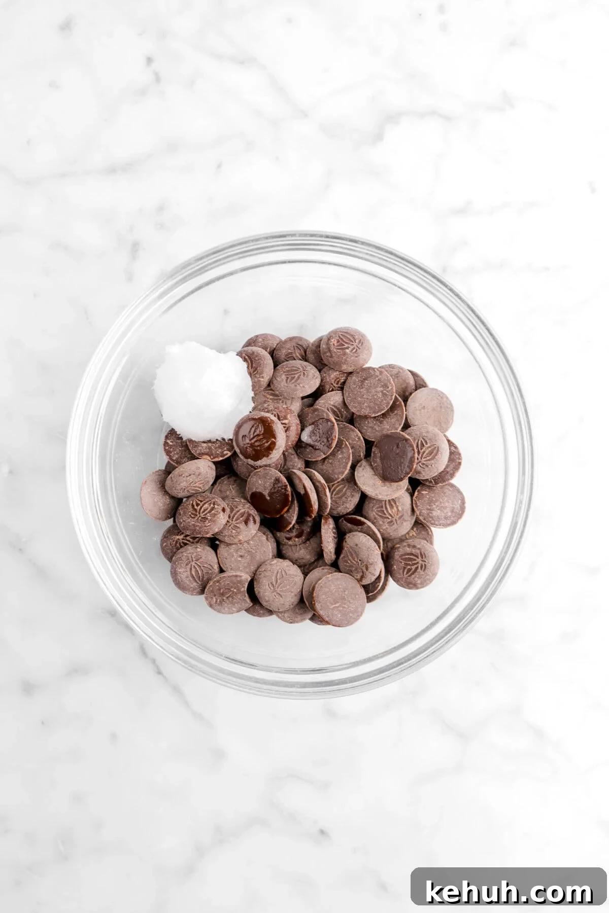 Coconut Cream-Filled Chocolate Truffles: Decadent Homemade Recipe 13 chocolate discs and coconut oil in glass bowl