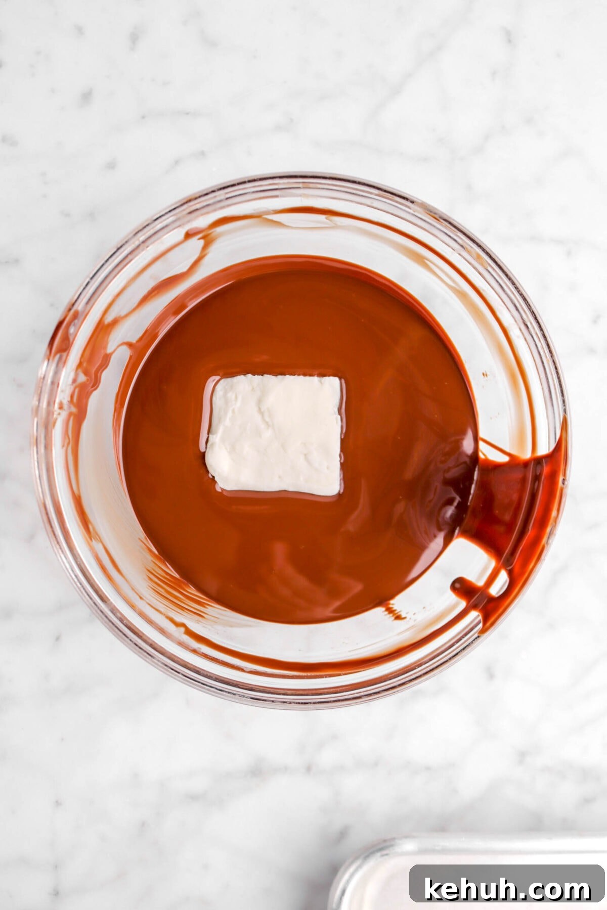 Coconut Cream-Filled Chocolate Truffles: Decadent Homemade Recipe 15 coconut fondant square in bowl of melted chocolate