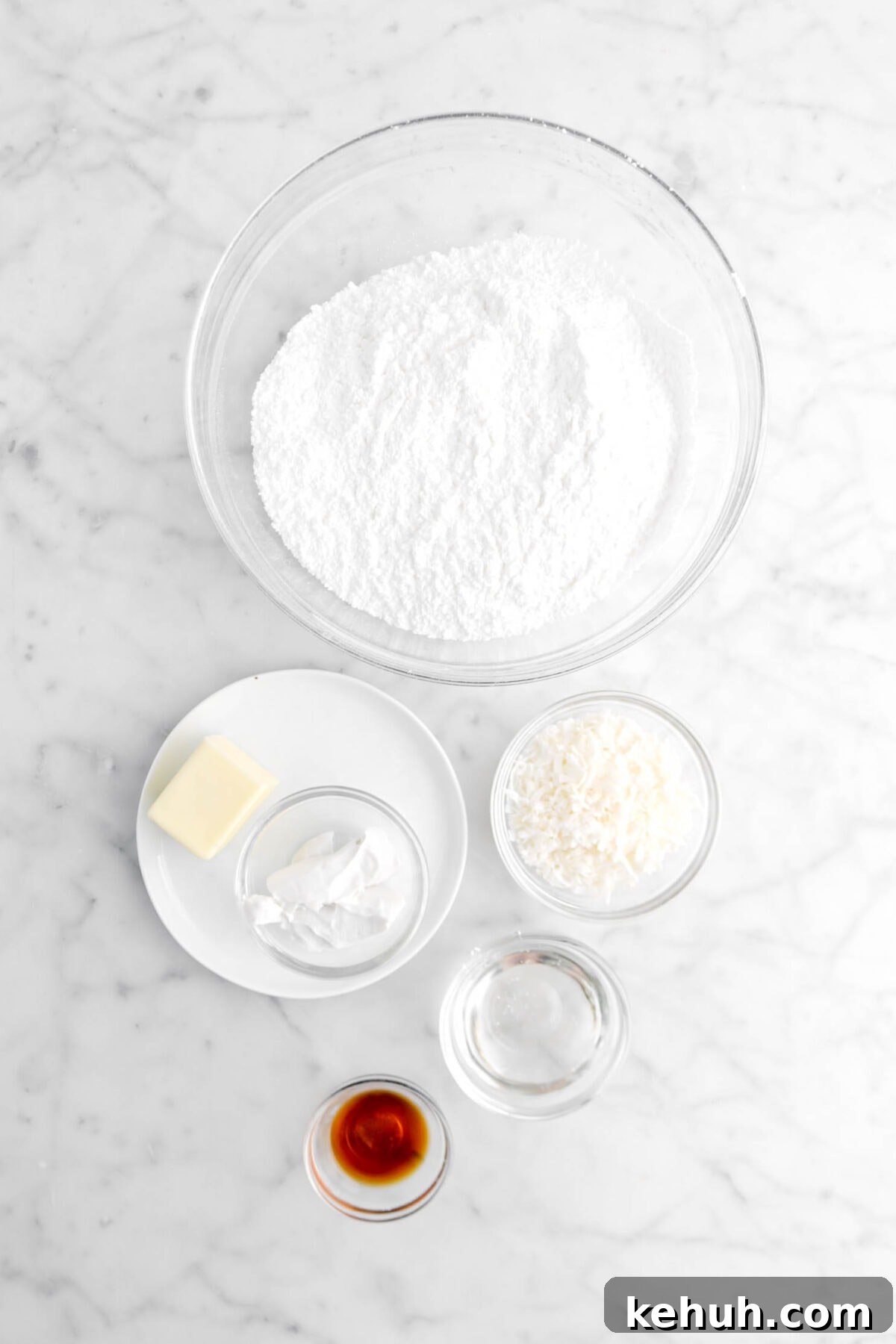 Coconut Cream-Filled Chocolate Truffles: Decadent Homemade Recipe 7 powdered sugar, butter, coconut cream, coconut flakes, corn syrup, and vanilla extract on marble surface