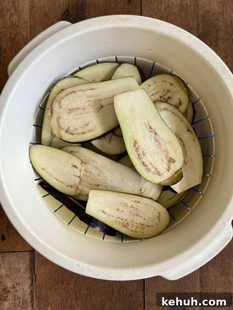 Draining the eggplant.