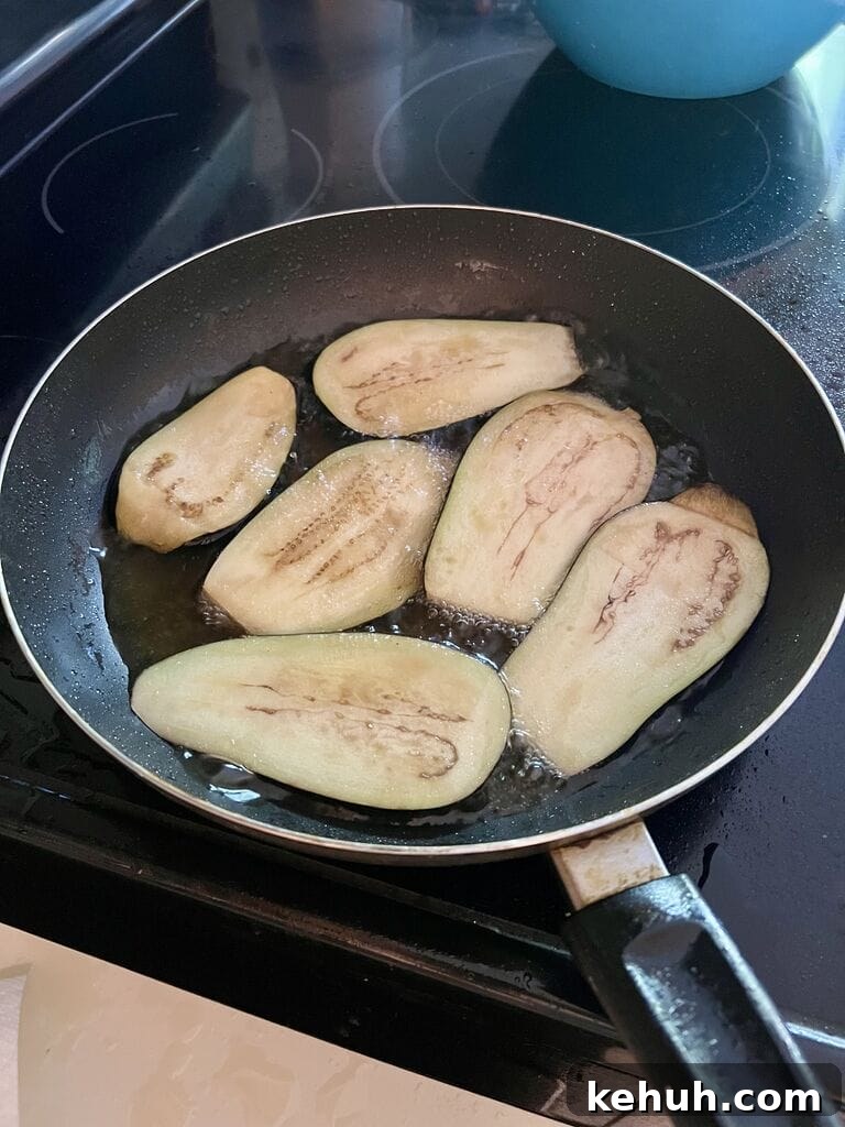 Frying the eggplant.