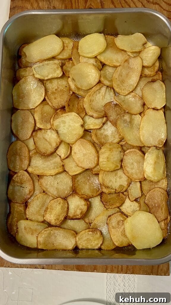 Layering the potatoes.