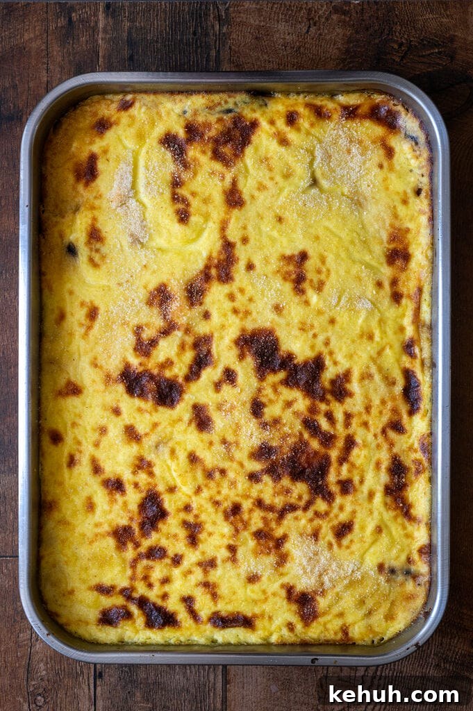 Moussaka in a stainless steel pan.