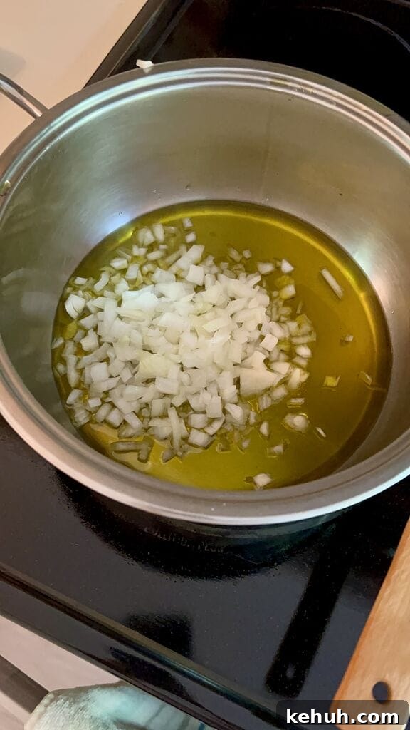 Sautéing the onion in olive oil.