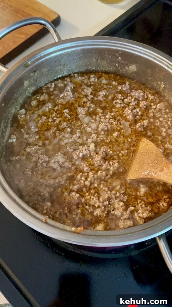 Making the meat sauce.
