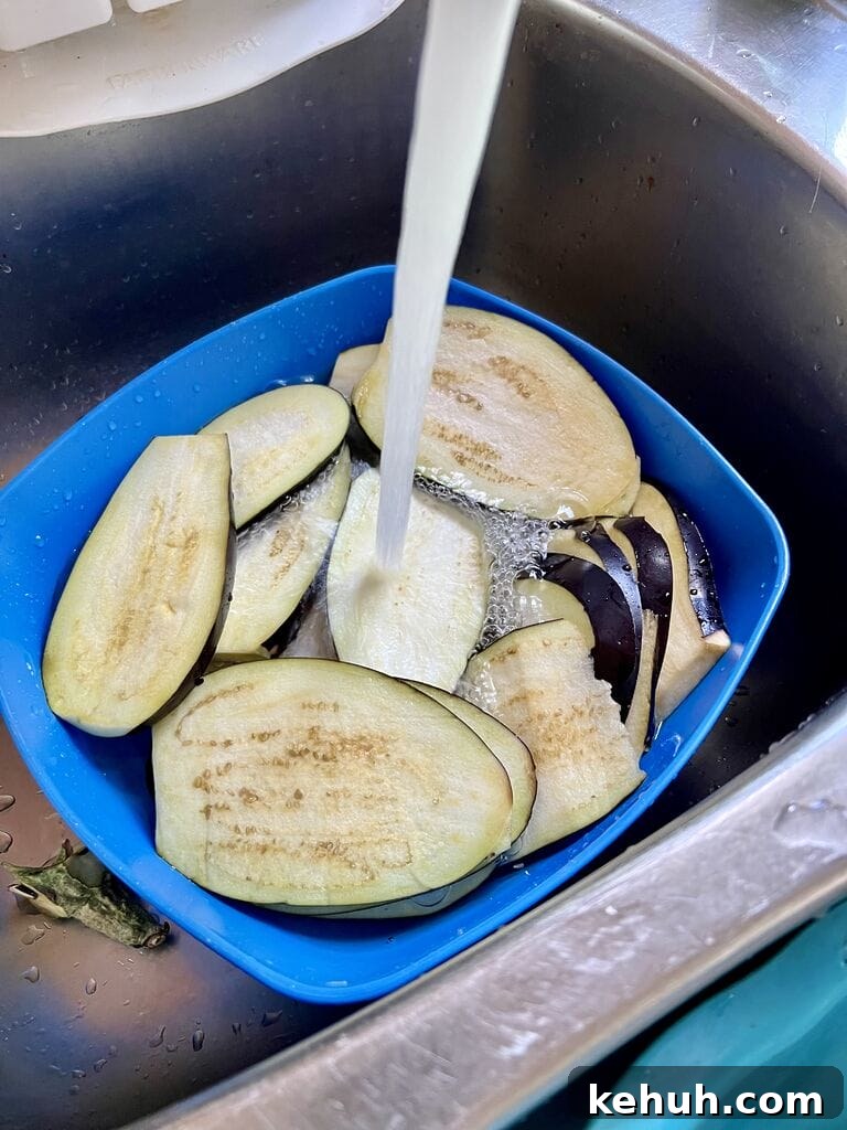 Rinsing the eggplant.