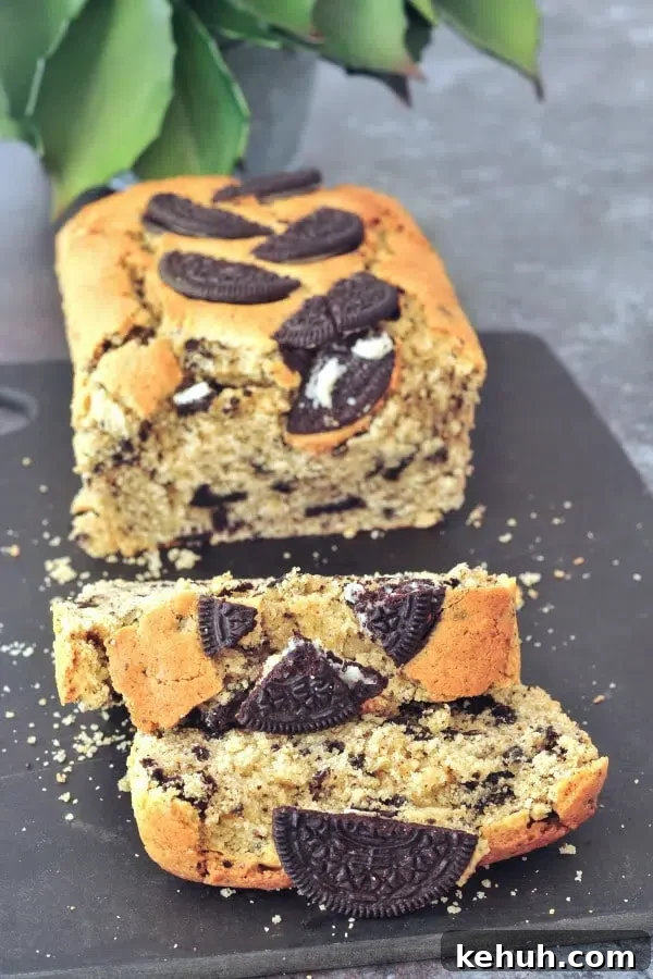a loaf of Vegan Pound Cake on a cutting board with two slices cut 