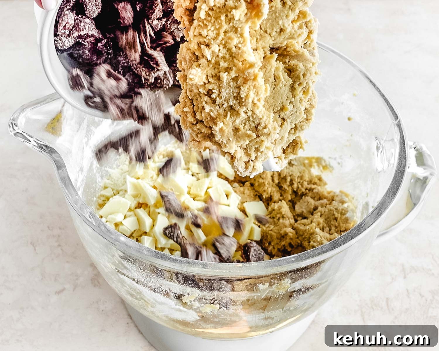 Add the chopped dried strawberries to the mixer bowl.