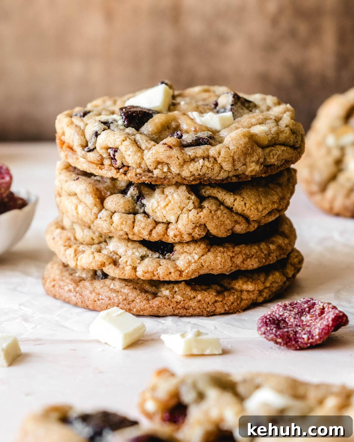 Stack of four chewy white chocolate strawberry cookies made with dried strawberries.