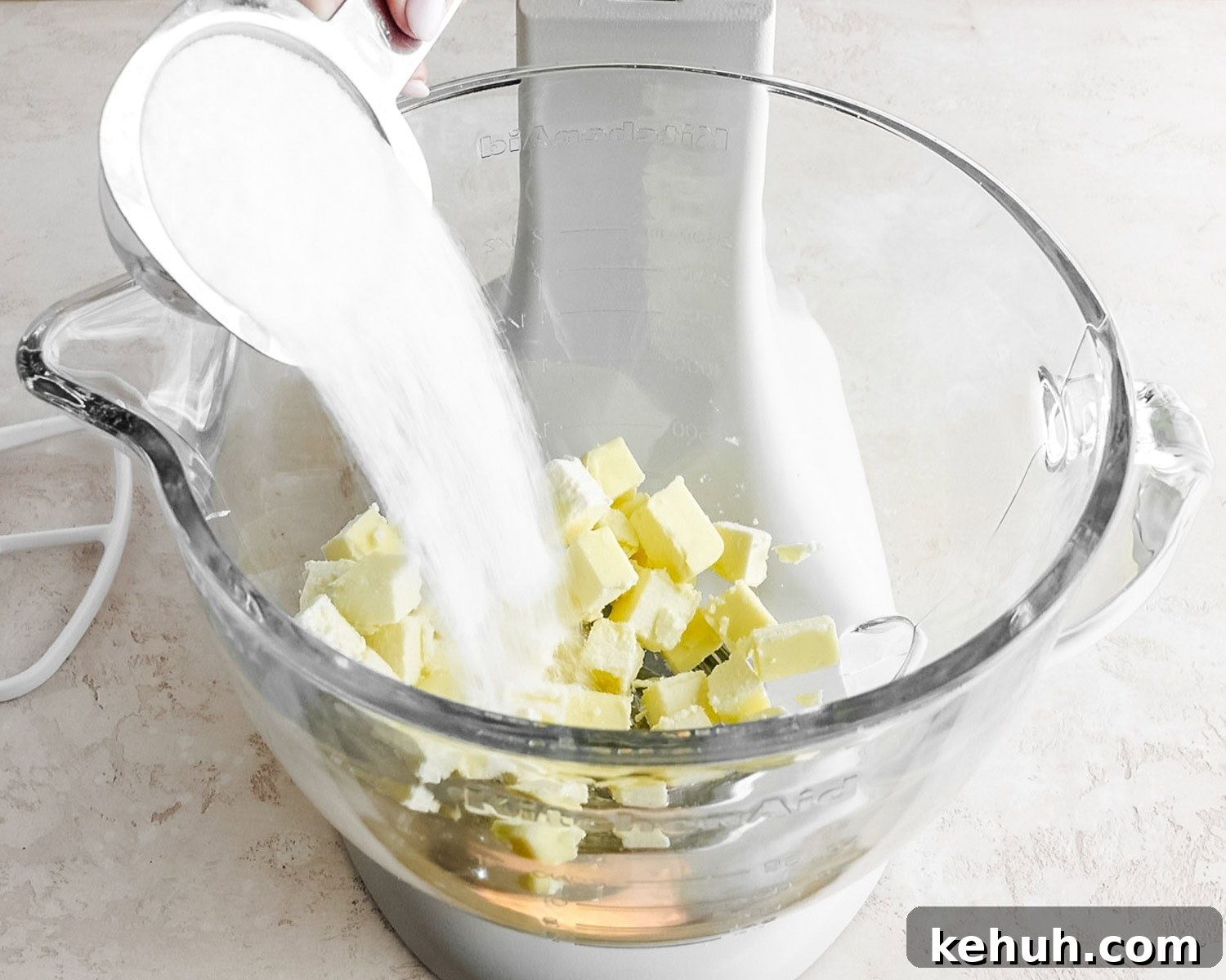 Add granulated sugar to the butter in the bowl of a stand mixer.