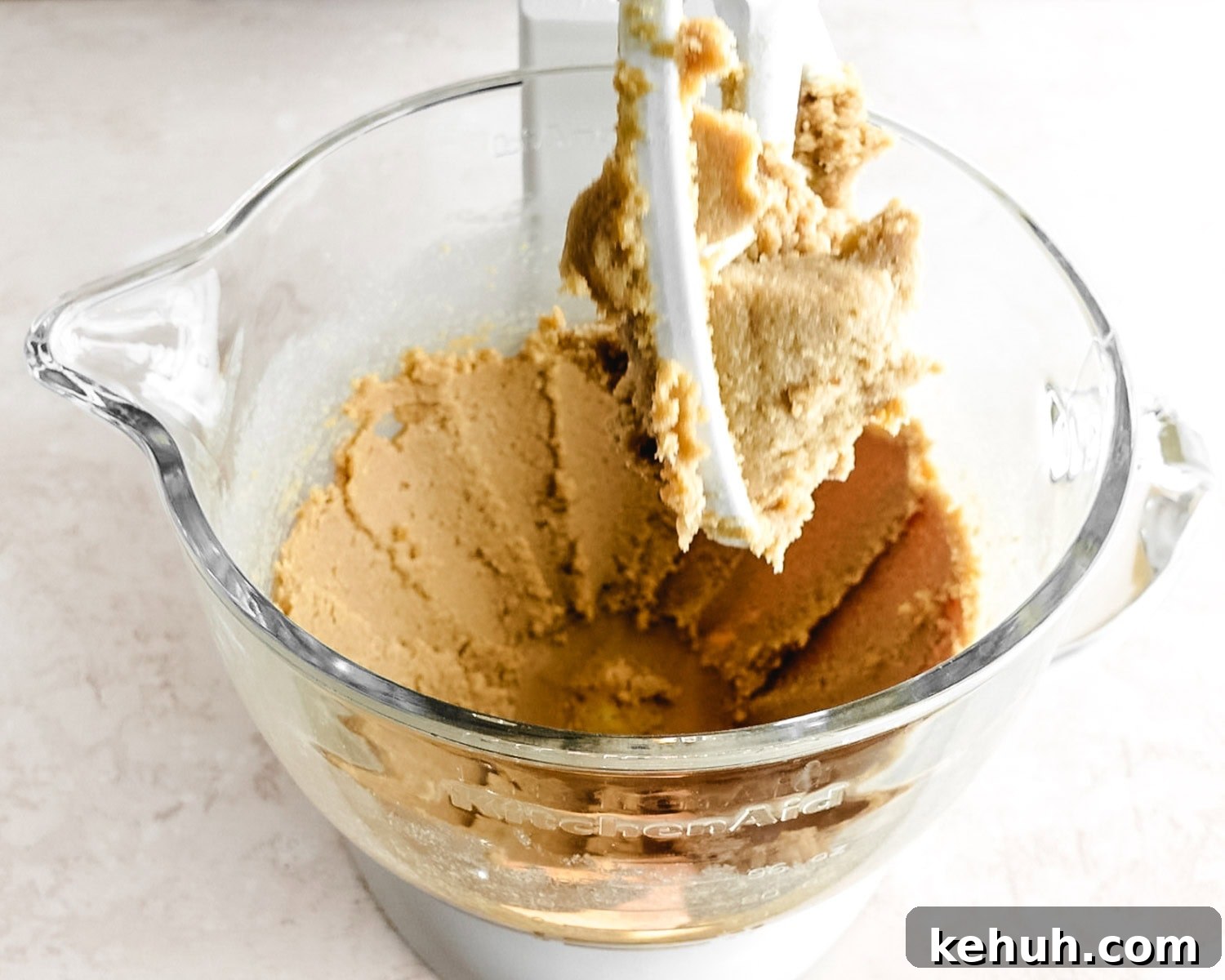 Mix butter and sugars together until light and fluffy and sticking to the sides of the bowl.