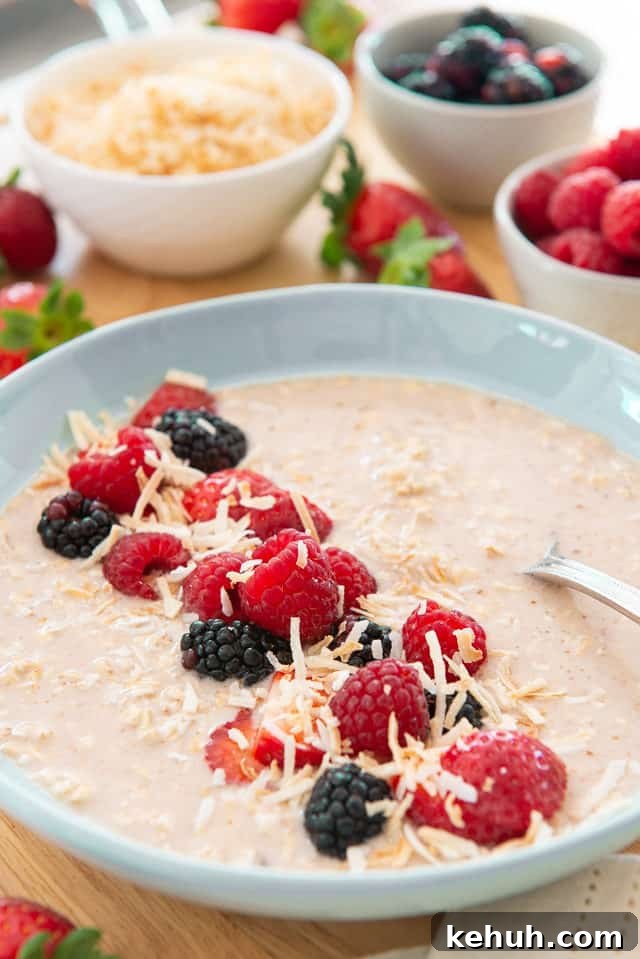 Overnight Oats - Simple and Healthy Breakfast Presented in Blue Low Bowl and Garnished with Raspberries and Blackberries