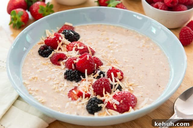 Overnight Oats Recipe - Shown in Blue Bowl Garnished with Fresh Berries and Coconut