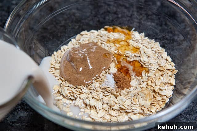 How to Make Overnight Oats - Combine Oats in Bowl With Nut Butter, cinnamon, maple syrup, and more as shown