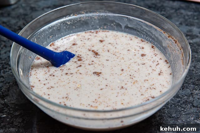Easy Overnight Oats - Shown in Mixing Bowl With Honey and Spices and Other Customizable Ingredients
