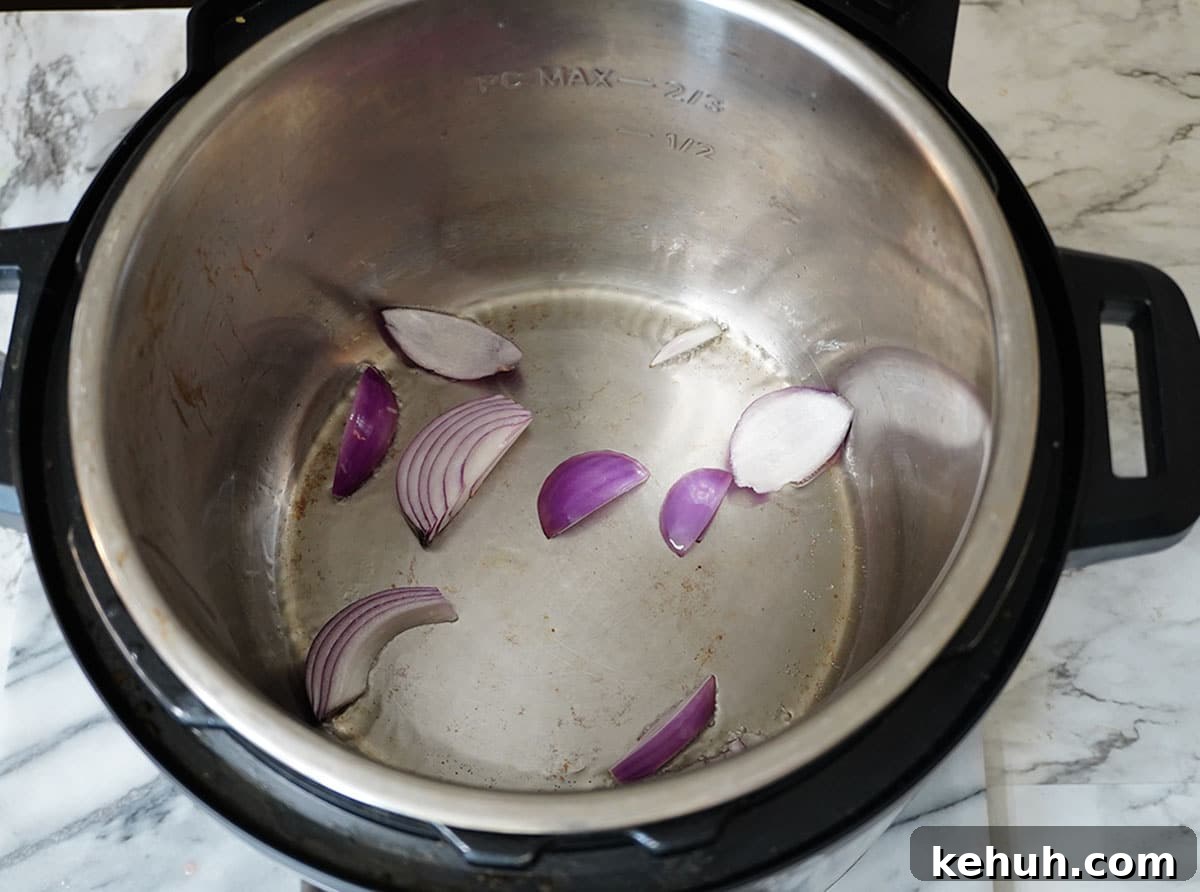 Instant Pot Beef and Cabbage Stew Recipe for Tender Meat 5 Sautee the onion