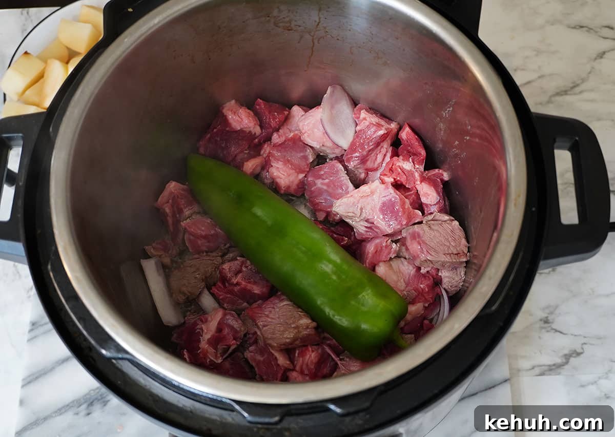 Instant Pot Beef and Cabbage Stew Recipe for Tender Meat 7 Put the anaheim pepper on top