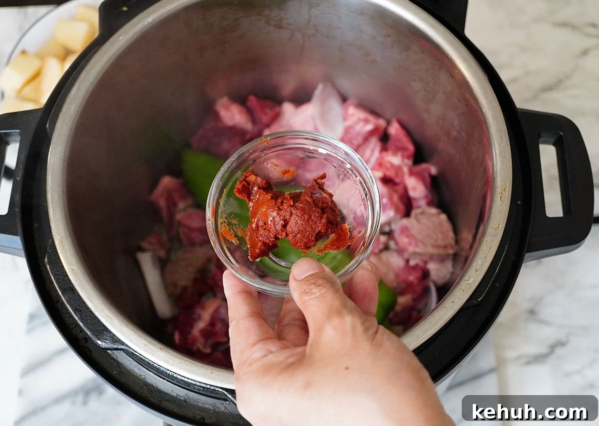 Instant Pot Beef and Cabbage Stew Recipe for Tender Meat 8 Add the tomato Paste