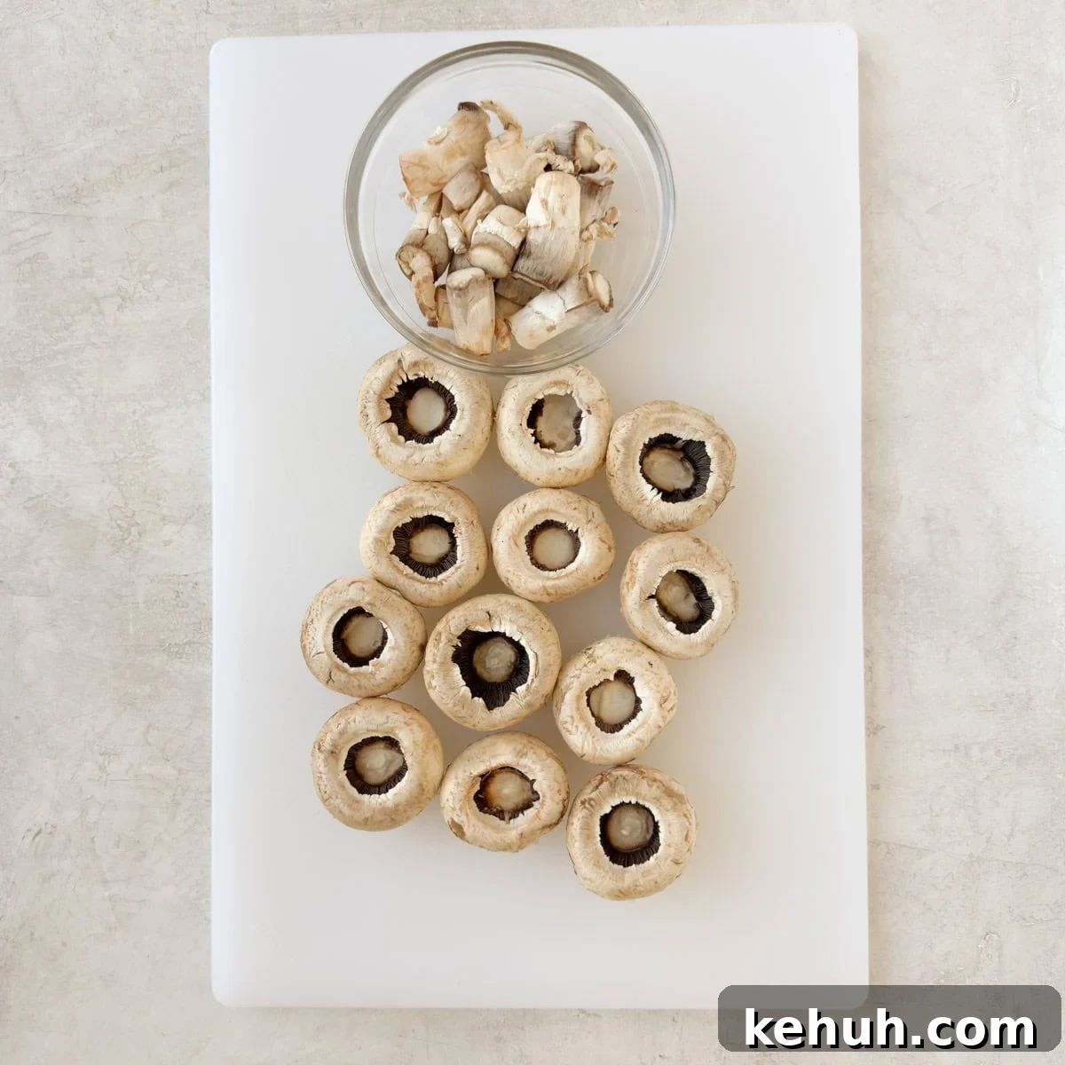 Parmesan Spinach-Stuffed Mushrooms: Savory Appetizer Recipe 6 Mushrooms with stems removed for filling.