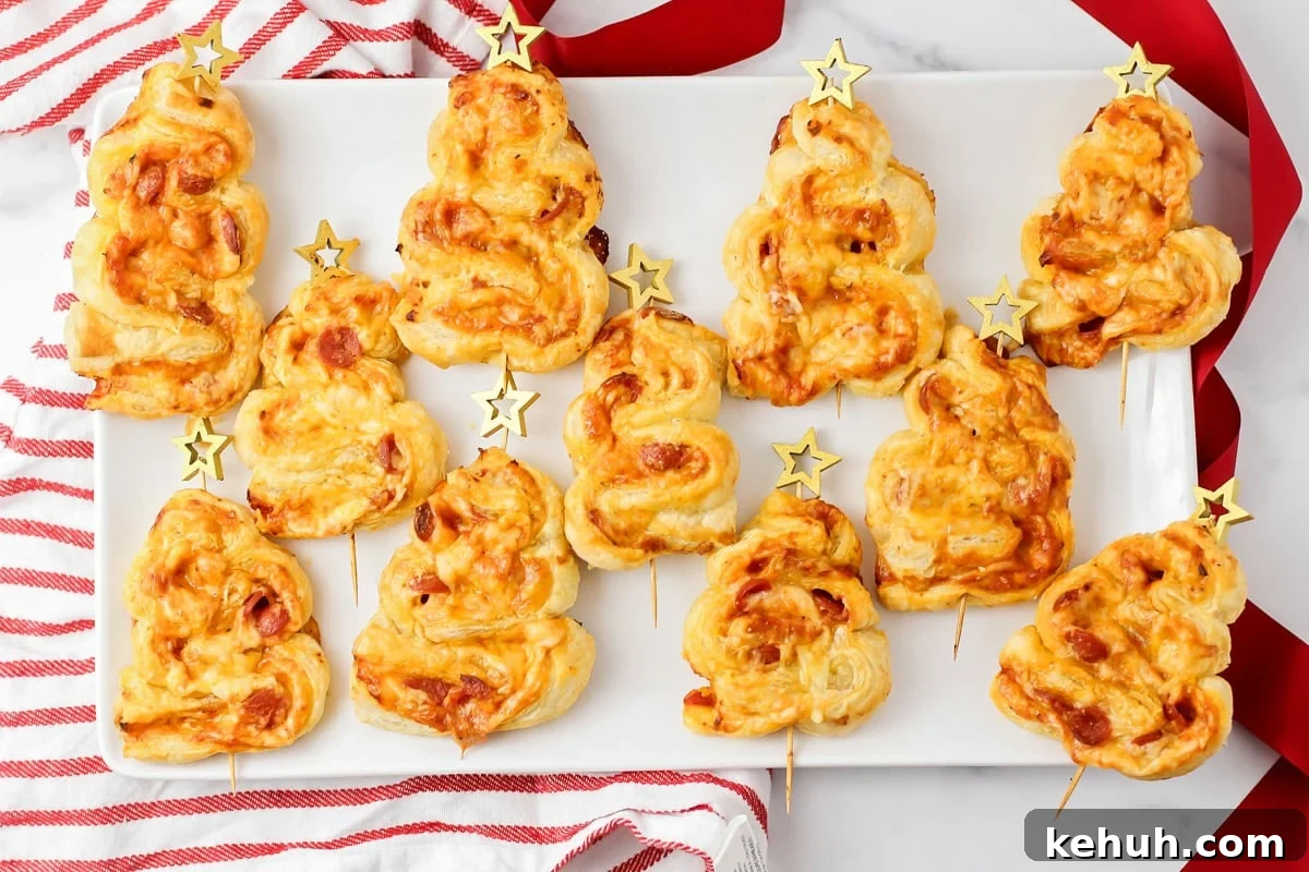 Christmas tree appetizers on white tray.
