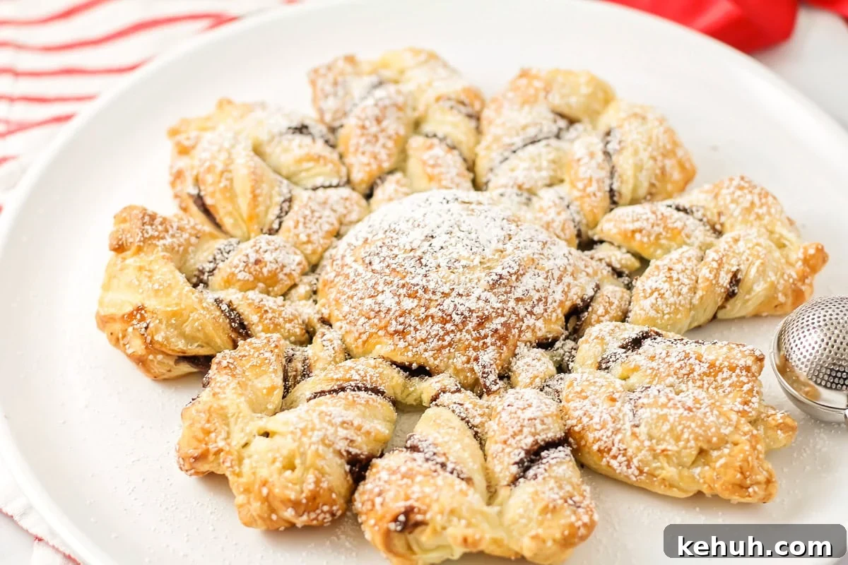 Puff Pastry snowflake on white dish.