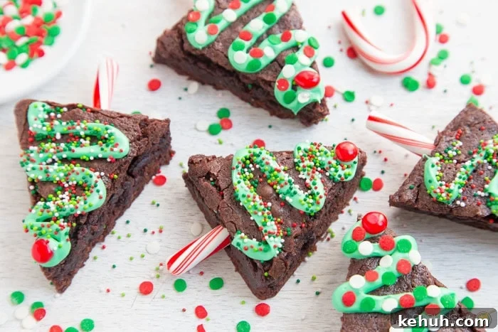 Christmas tree brownies with sprinkles around.