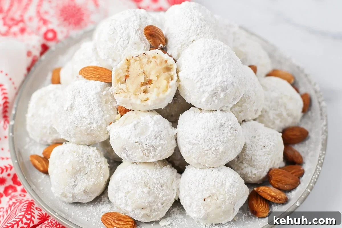 Homemade snowball cookies on plate.