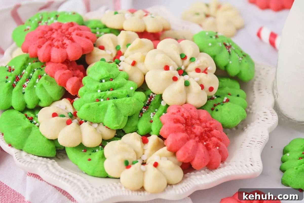 Spritz cookies on white plate.