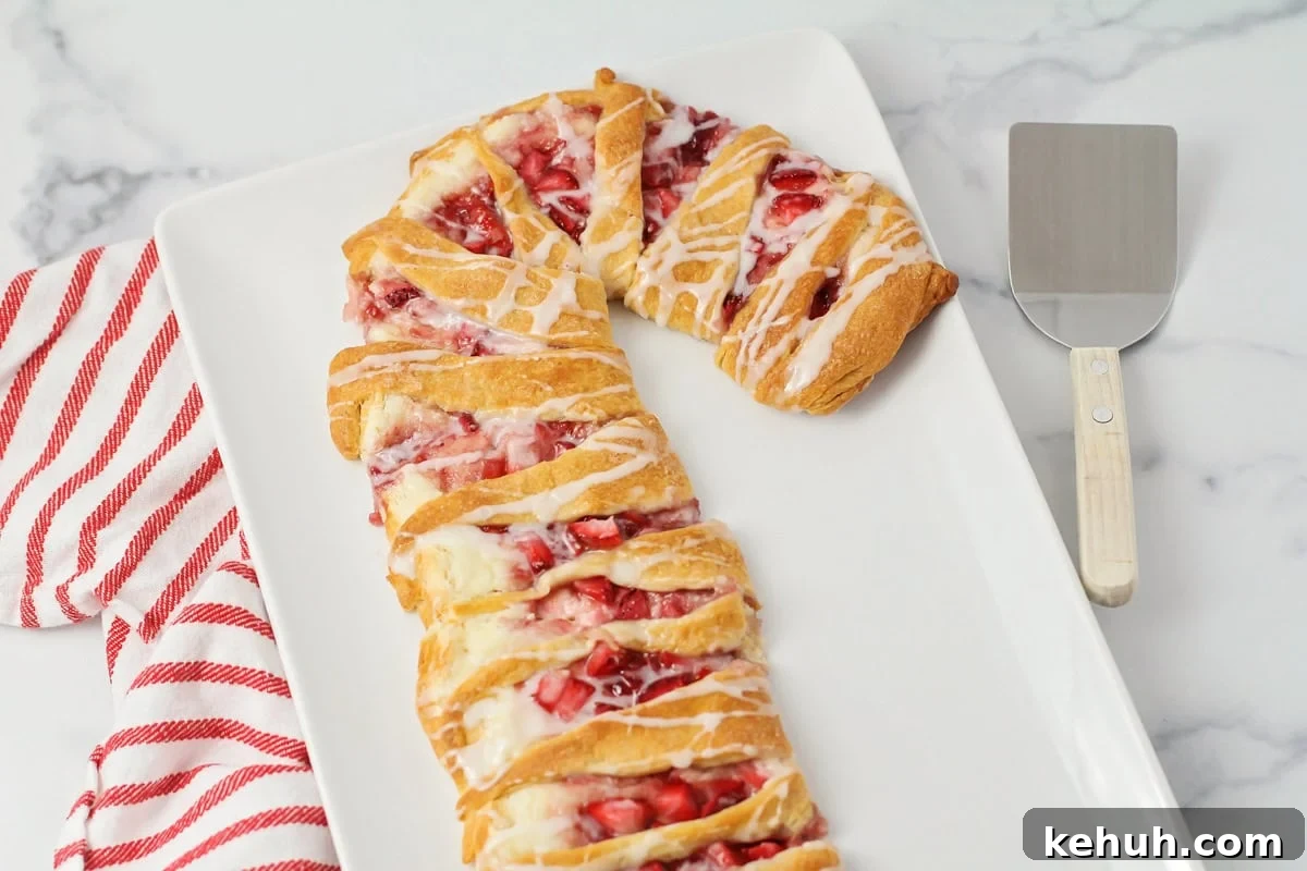 Candy cane danish recipe on white dish.