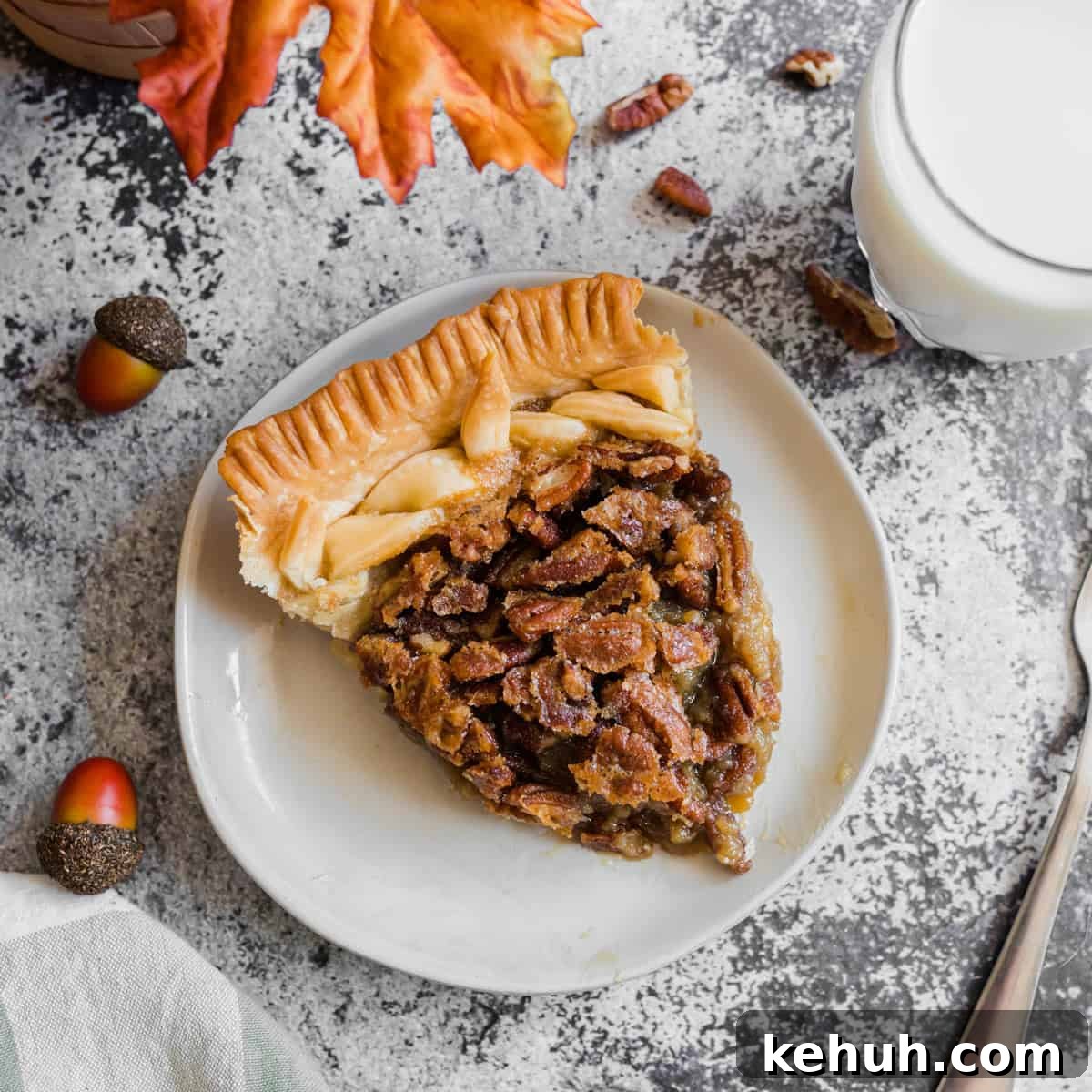 A slice of homemade pecan pie on a plate.
