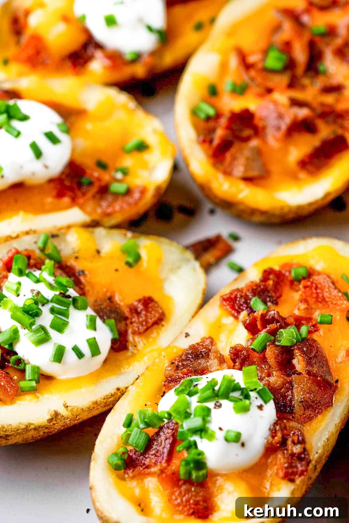 Crispy Air Fryer Potato Skins Filled with Cheesy Bacon 8 plate of air fryer potato skins.
