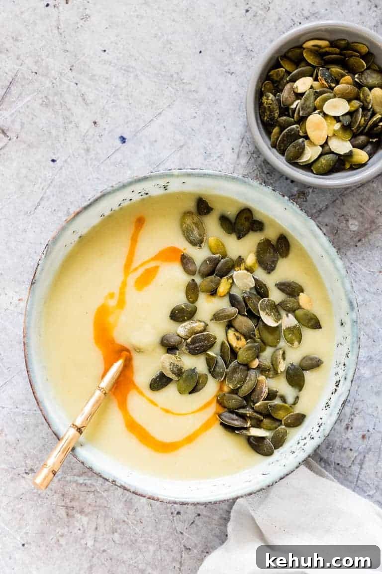 Instant Pot Soup Recipes You’ll Actually Love 22 potato soup in bowls with pumpkin seeds and chili oil